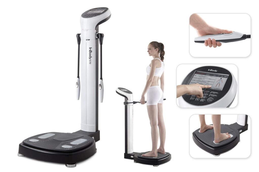 InBody body composition analyzer with a woman standing on the platform.