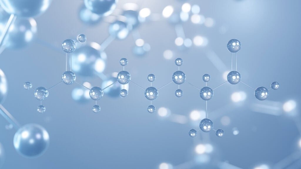 Molecular structure of peptides and vitamins with interconnected spheres and bonds.