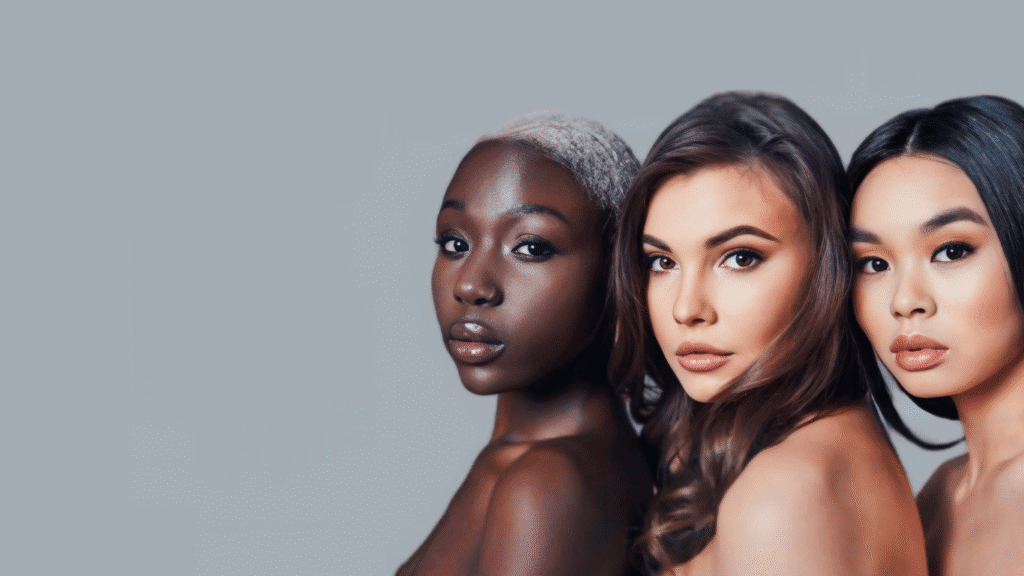 Clear skin and diverse beauty among three women with different ethnic backgrounds.
