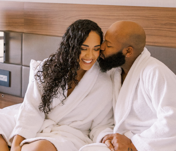 Regenerative O-Shot - aka Orgasm Shot , happy couple in bed wit robes on